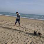 Bournemouth - Girish walking on sand naked legs